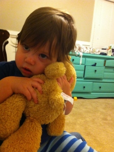 Noah learns to give his bear a hug.